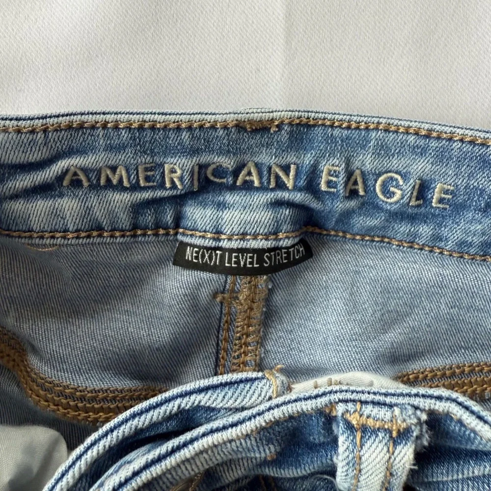American Eagle Super Hi-Rise Jegging Distressed Blue Jeans Next Level Stretch 0